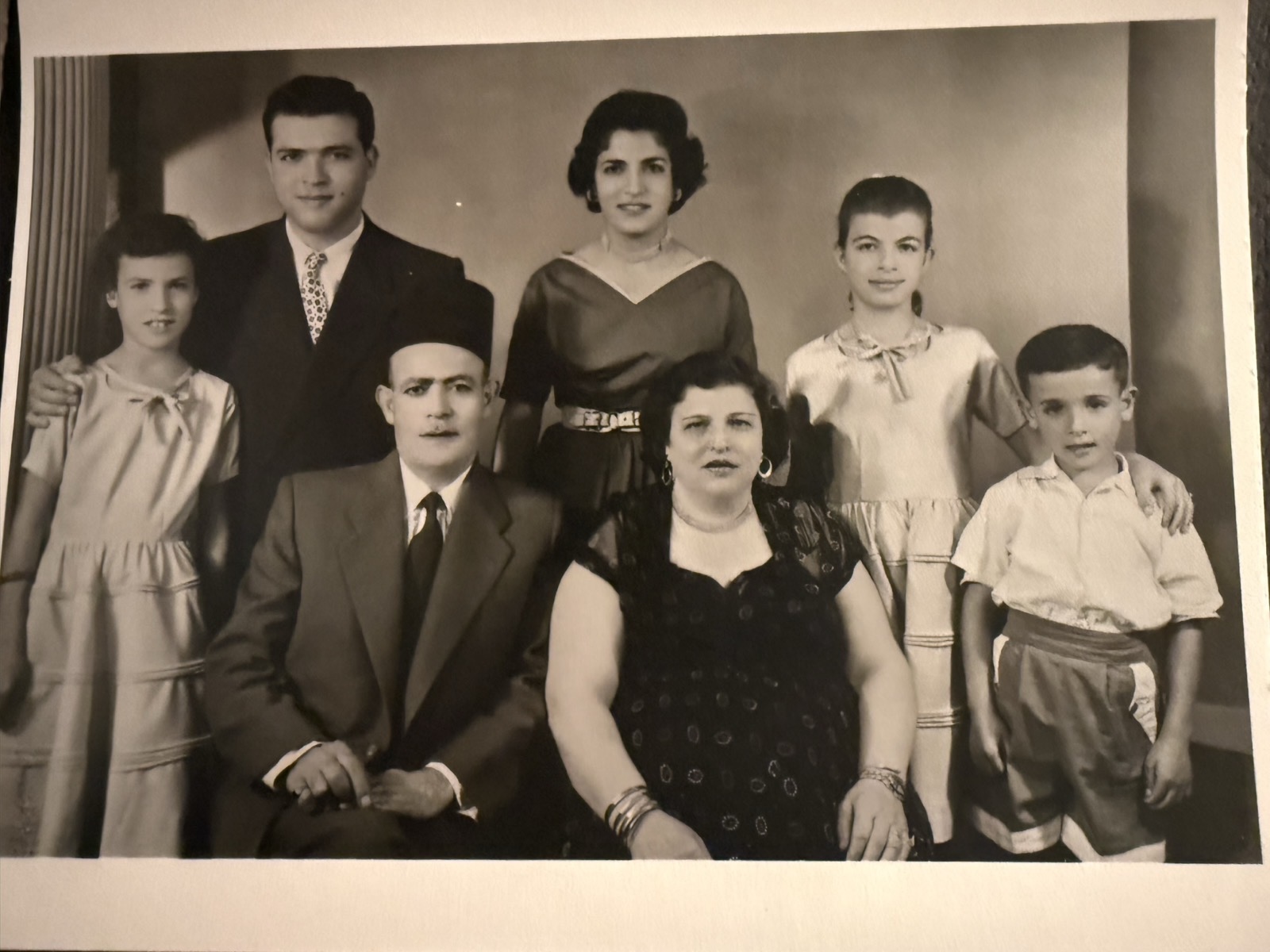 Black-and-white studio portrait of Abdallah Zalatimo, his wife Rabiha Ghoseh and their children Aref, Afaf, Fadia, Shadia and Akram